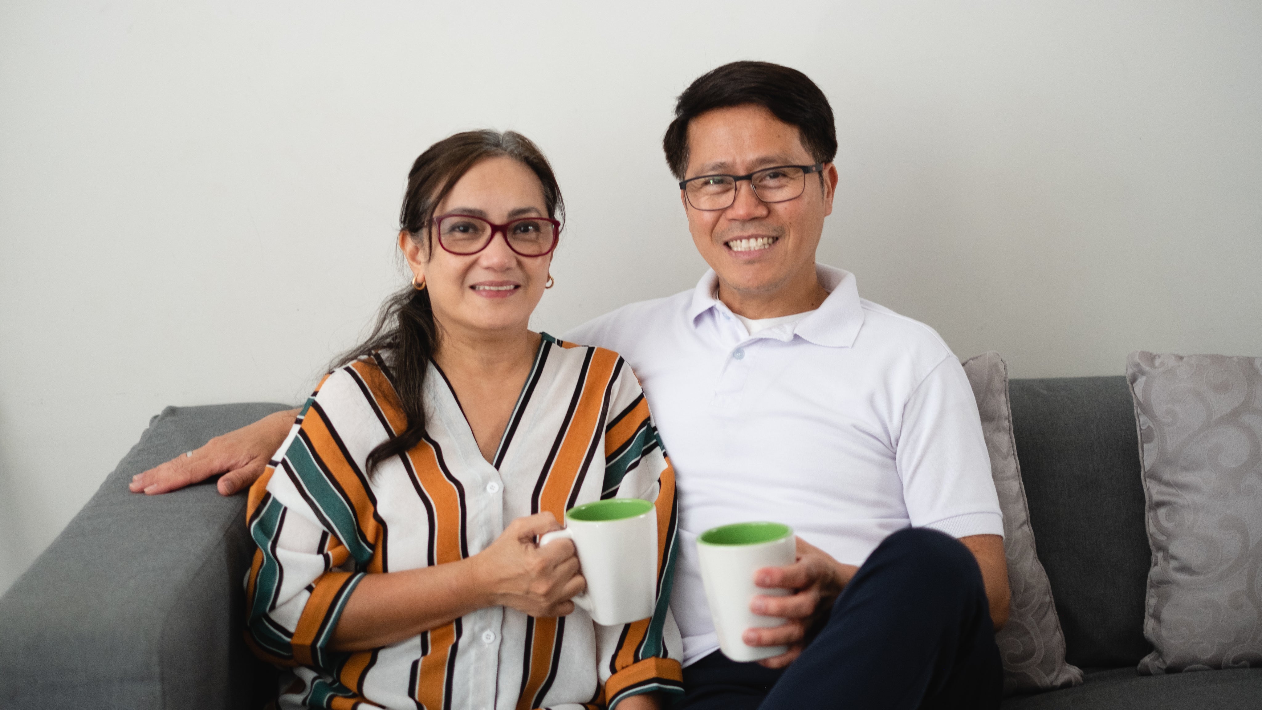 files/couple-sitting-on-couch-with-coffees.jpg